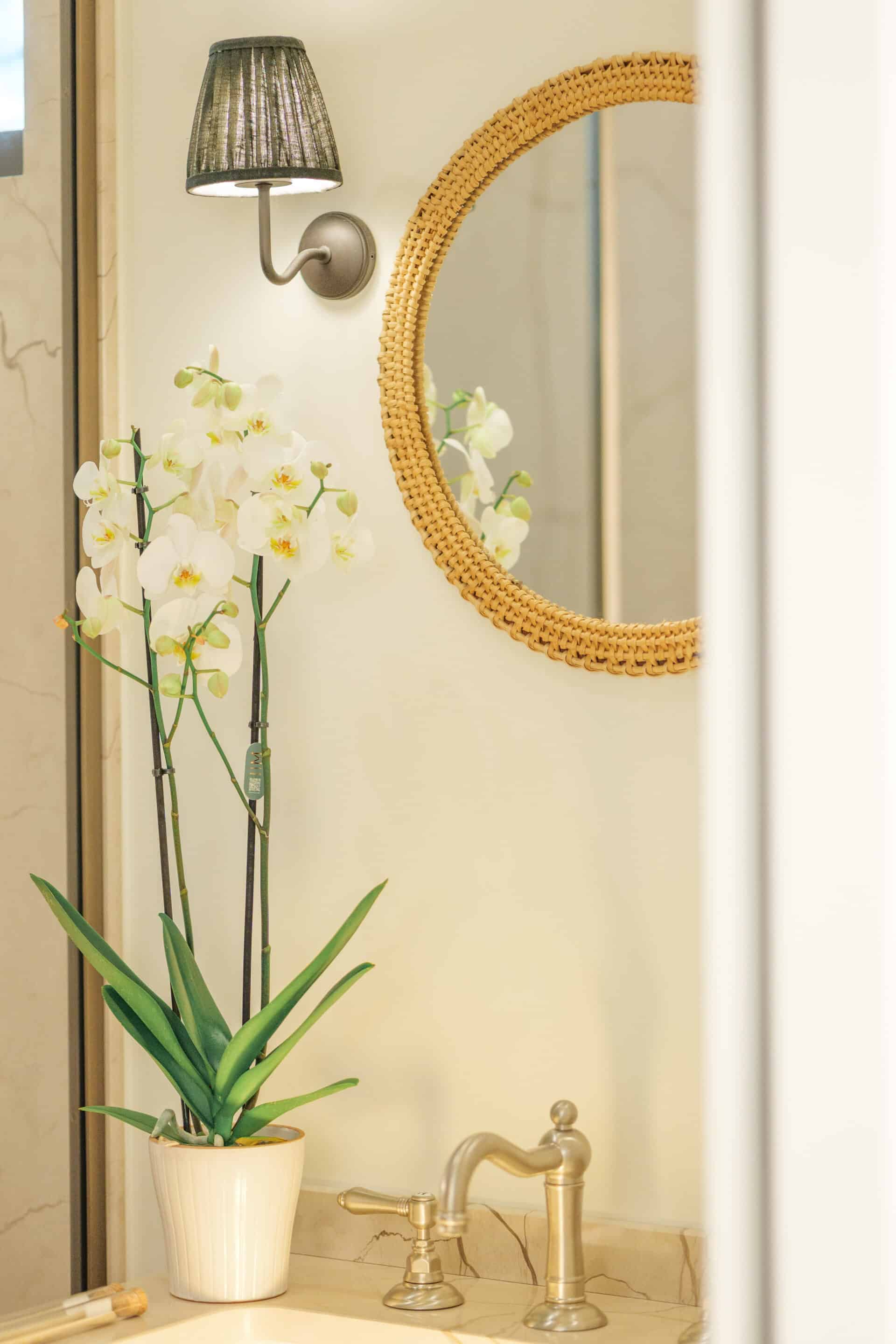 Nickel faucet from Officina Nicolazzi , hardware and sconces from Corston Architectural Design. Vintage rattan mirror.