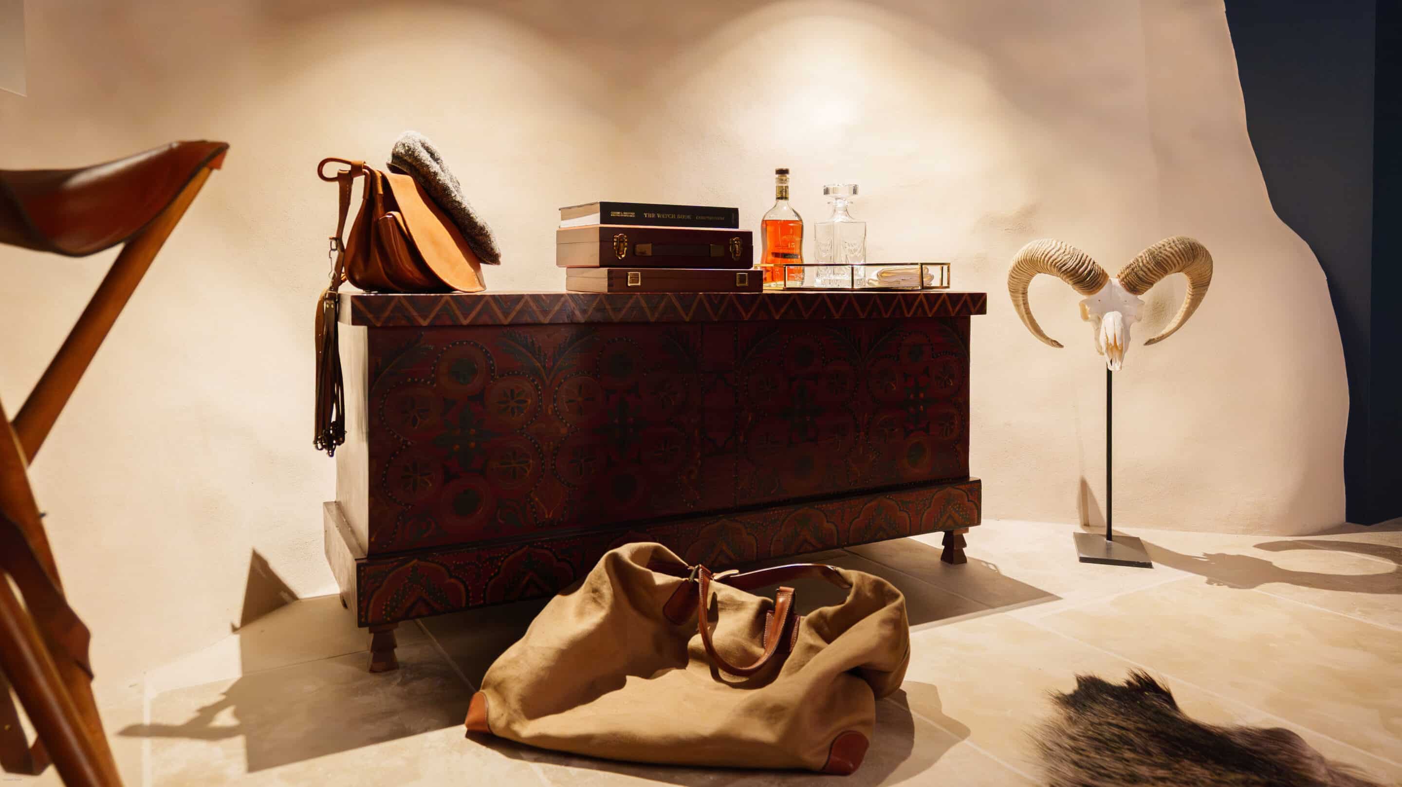 In keeping with the rest of the house, a quiet and serene second guest room with the same mix of vintage and custom designs. A bespoke dark blue bouclé bed and headboard by KS STUDIO DESIGN is paired with original Reguin side tables.The bespoke headboard fits the width of the room perfectly.