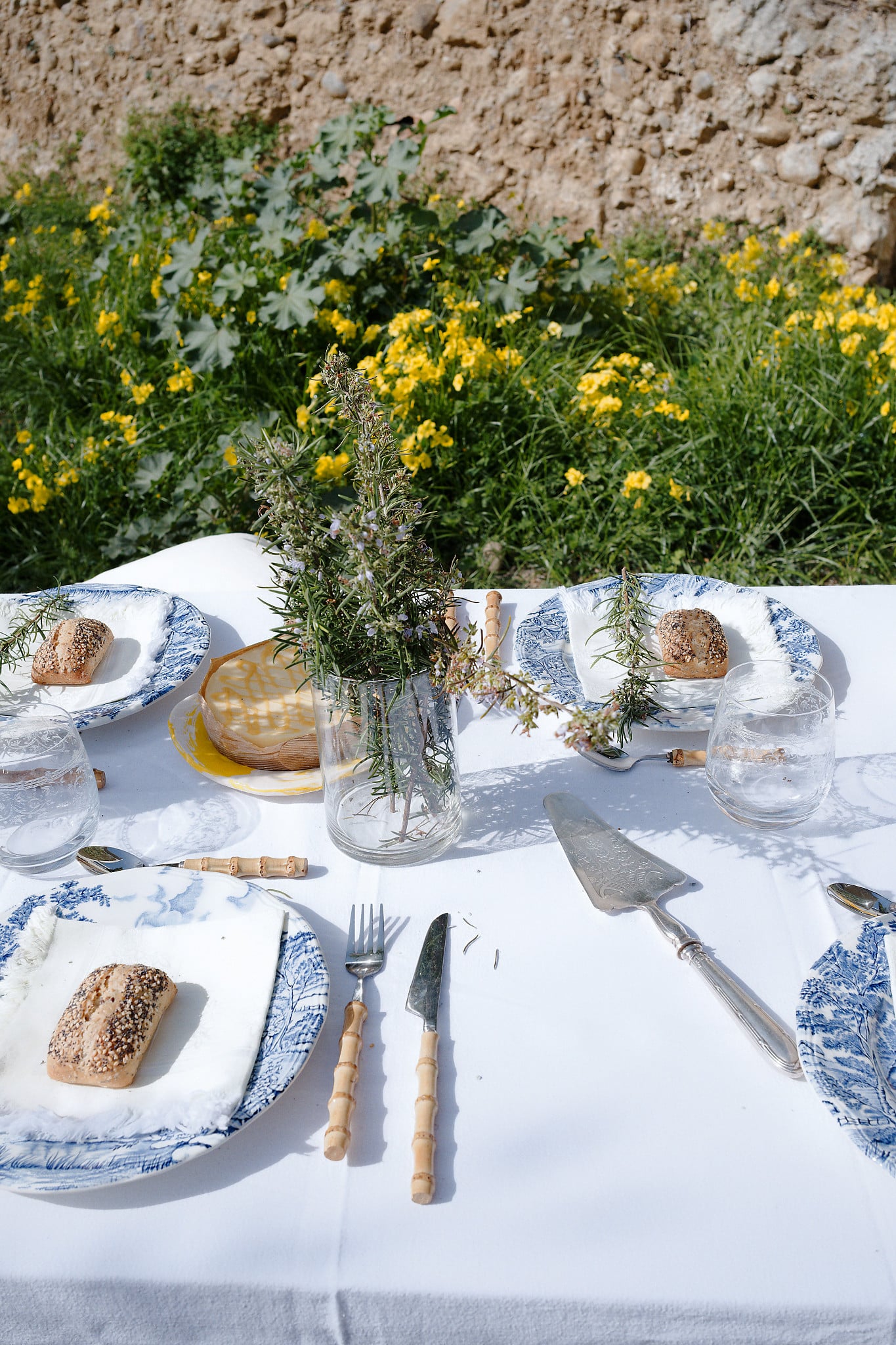 mediterranean easter table styling with lemons and blue vintage plates